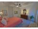 Spacious main bedroom featuring a tray ceiling, carpet floors, and plenty of natural light at 516 Barnwood Dr, Rockmart, GA 30153