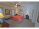 Comfortable main bedroom featuring a tray ceiling, carpet floors, and plenty of natural light at 516 Barnwood Dr, Rockmart, GA 30153