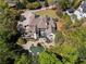 Aerial view of estate showcasing the home's layout, pool, landscaping, and circular driveway at 1015 Bedford Gardens Dr, Alpharetta, GA 30022