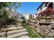 Beautiful stone steps, lush landscaping, and rock features add to the backyard's appeal at 1015 Bedford Gardens Dr, Alpharetta, GA 30022