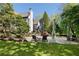 Expansive backyard featuring a pool, stone patio, and plenty of space for outdoor activities at 1015 Bedford Gardens Dr, Alpharetta, GA 30022