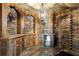 Unique bar area with stone walls, custom wood cabinets, and decorative lighting at 1015 Bedford Gardens Dr, Alpharetta, GA 30022