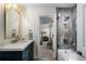 Bathroom with a shower and separate tub visible from the vanity area through an open door at 1015 Bedford Gardens Dr, Alpharetta, GA 30022