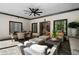 Covered patio with ceiling fan, dining table, and cushioned outdoor seating at 1015 Bedford Gardens Dr, Alpharetta, GA 30022