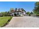 Stately home with circular driveway and meticulously landscaped front yard at 1015 Bedford Gardens Dr, Alpharetta, GA 30022