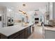 Gourmet kitchen featuring a large center island, stainless steel appliances, and custom cabinetry at 1015 Bedford Gardens Dr, Alpharetta, GA 30022