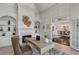 Luxury office with custom built-ins, fireplace, desk and double doors to dining room at 1015 Bedford Gardens Dr, Alpharetta, GA 30022