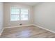 Bedroom with natural light and laminate wood flooring at 2020 Buckingham Ct, Decatur, GA 30035