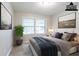 This staged bedroom has two windows and decor at 2020 Buckingham Ct, Decatur, GA 30035