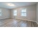 Spacious bedroom offers wood-look flooring and lots of natural light at 2020 Buckingham Ct, Decatur, GA 30035