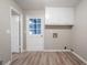 Laundry room has door to outside and wall cabinets at 2020 Buckingham Ct, Decatur, GA 30035
