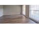 Sun-filled living room features new hardwood floors and large windows for natural light at 2020 Buckingham Ct, Decatur, GA 30035