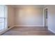 Spacious and bright room with modern flooring, neutral paint, and ample natural light at 2020 Buckingham Ct, Decatur, GA 30035