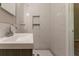 Bathroom featuring tiled walls, shower with niche and modern vanity at 2814 Brackenwood Dr, Snellville, GA 30039