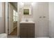 Bathroom featuring tiled walls, modern vanity and fixtures at 2814 Brackenwood Dr, Snellville, GA 30039