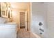 Well-lit bathroom with double vanity, white subway tile, and modern fixtures for a sleek and functional space at 2814 Brackenwood Dr, Snellville, GA 30039