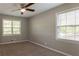 Comfortable bedroom featuring neutral walls and a ceiling fan at 2814 Brackenwood Dr, Snellville, GA 30039