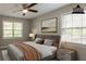 Virtually staged bedroom featuring neutral walls and a ceiling fan at 2814 Brackenwood Dr, Snellville, GA 30039