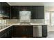 Well-equipped kitchen featuring modern appliances, a large sink, and lots of counter space at 2814 Brackenwood Dr, Snellville, GA 30039