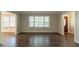 Spacious living area with gleaming hardwood floors and neutral wall color at 2814 Brackenwood Dr, Snellville, GA 30039