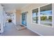 Inviting covered front porch with a charming blue door and ample natural light at 3286 Bachelor St, East Point, GA 30344