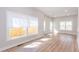 Bright living room with large windows, light flooring, and neutral paint for a modern feel at 3286 Bachelor St, East Point, GA 30344