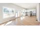 Open concept living space with wood floors, a white kitchen and patio access at 3286 Bachelor St, East Point, GA 30344