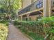 Backyard view from a gravel path, with a wood railing and a well-maintained lawn at 3500 Stonewall Pl, Atlanta, GA 30339
