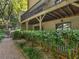 Backyard view from a gravel path, with a wood railing and a well-maintained lawn at 3500 Stonewall Pl, Atlanta, GA 30339
