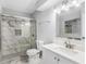 Bathroom with marble tiled walk-in shower, white vanity, and stylish fixtures at 3500 Stonewall Pl, Atlanta, GA 30339