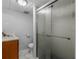 Bathroom featuring a toilet, marble floor, a vanity, and a glass shower at 3500 Stonewall Pl, Atlanta, GA 30339