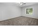 Bedroom features ceiling fan, and neutral carpet at 3500 Stonewall Pl, Atlanta, GA 30339