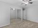 Bedroom features ceiling fan, mirrored closet, and neutral carpet at 3500 Stonewall Pl, Atlanta, GA 30339