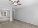 Bedroom features ceiling fan, mirrored closet, and neutral carpet at 3500 Stonewall Pl, Atlanta, GA 30339