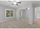 Bedroom with closet, ceiling fan, carpet, and exterior view window at 3500 Stonewall Pl, Atlanta, GA 30339