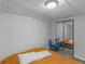 Cozy bedroom featuring an orange bedspread, twin bed, and sliding mirrored closet at 3500 Stonewall Pl, Atlanta, GA 30339
