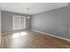 Bright dining room with hardwood floors and window that provides plenty of natural light at 3500 Stonewall Pl, Atlanta, GA 30339
