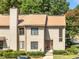 Charming two-story townhouse featuring a well-maintained lawn and a welcoming front entrance at 3500 Stonewall Pl, Atlanta, GA 30339