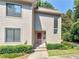 Charming two-story townhouse featuring a well-maintained lawn and a welcoming front entrance at 3500 Stonewall Pl, Atlanta, GA 30339