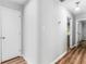 Hallway with hardwood floors connecting rooms in the house at 3500 Stonewall Pl, Atlanta, GA 30339