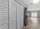 Spacious kitchen with white cabinets, stainless steel appliances, and wood-look flooring at 3500 Stonewall Pl, Atlanta, GA 30339