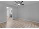 Spacious living room featuring hardwood floors and a peek into the kitchen in the background at 3500 Stonewall Pl, Atlanta, GA 30339