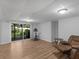Living Room with laminate flooring, easy chair, and sliding glass doors to the back yard at 3500 Stonewall Pl, Atlanta, GA 30339