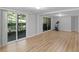 Spacious living room featuring laminate flooring and patio access at 3500 Stonewall Pl, Atlanta, GA 30339