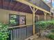 Private ground floor patio with metal railing, wood ceiling, and access to the yard at 3500 Stonewall Pl, Atlanta, GA 30339