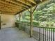 Covered patio with wood ceiling and views of the surrounding woods at 3500 Stonewall Pl, Atlanta, GA 30339