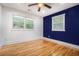 Bright bedroom features hardwood floors, large windows, and a modern ceiling fan at 446 Waterford Nw Rd, Atlanta, GA 30318