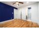 View of bedroom with closet and bathroom doors along with hardwood floors and ceiling fan at 446 Waterford Nw Rd, Atlanta, GA 30318