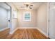 Cozy dining area with hardwood floors, neutral paint, and a ceiling fan for added comfort at 446 Waterford Nw Rd, Atlanta, GA 30318