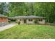 Inviting single-story home featuring well-maintained landscaping and a comfortable, welcoming appeal at 446 Waterford Nw Rd, Atlanta, GA 30318